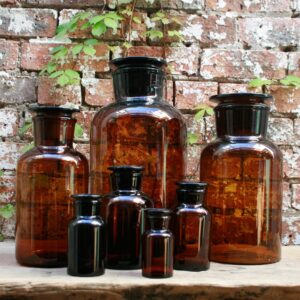 Glass amber apothecary bottles with lids